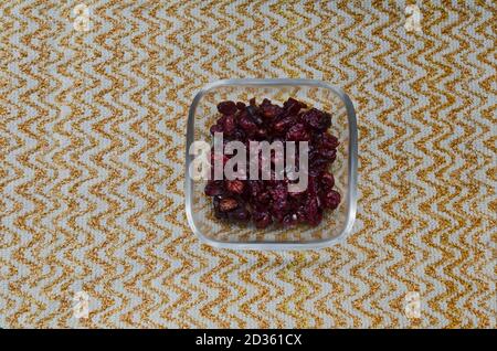 Portion of dried ripe Cranberry or Vaccinium oxycoccos fruit in a small bowl, Sofia, Bulgaria Stock Photo