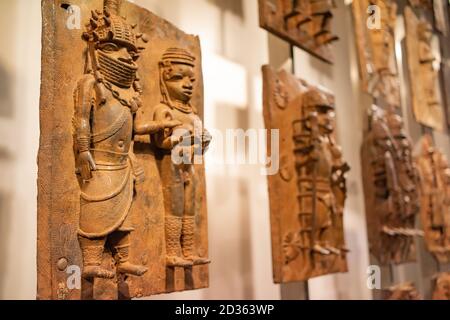 London. England. Benin Bronzes on display at the British Museum, brass plaques from the royal court palace of the Kingdom of Benin, 16-17th century Stock Photo