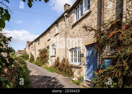 A row of stone cottages in the Cotswold village of Bisley, Gloucestershire UK Stock Photo