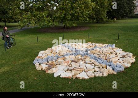 London, UK.  7 October 2020.  A woman views 'Circle for Sally', 2016, by Richard Long at Frieze Sculpture, an annual exhibition of outdoor works by international artists in Regent’s Park.  The works are on display to the public until 18 October.  Credit: Stephen Chung / Alamy Live News Stock Photo