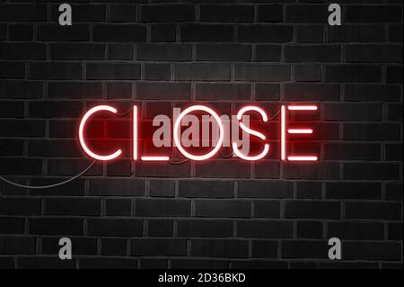 CLOSE red neon sign on brick wall Stock Photo