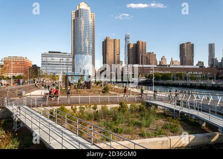 Visitors flock to the newly opened Pier 26 in Hudson River Park in New York on Saturday, October 3, 2020. The 2.5 acre addition to the park contains a sports facility, a lawn, an elevated deck with indigenous plants below and manmade tidal pools.  (© Richard B. Levine) Stock Photo