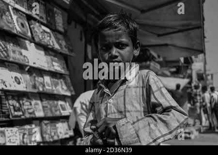 A poor child begging for food and money Stock Photo