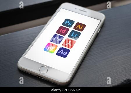 Guilherand-Granges, France - October 07, 2020. Smartphone with Adobe logos. Set of applications and services from Adobe. Collection of software for gr Stock Photo
