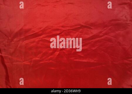 crumpled red fabric, abstract scarlet background, top view Stock Photo