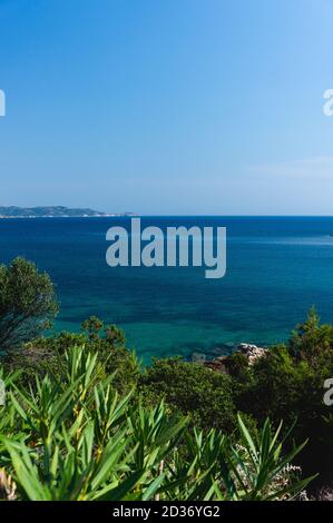 crystal clear mediterranean sea under the blue sky. Marina di Teulada Stock Photo