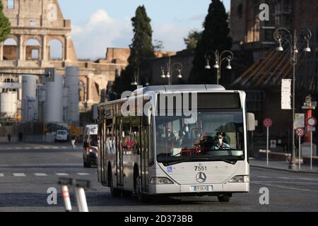 Rome, Italy. 6th Oct, 2020. A bus driver wearing a face mask works in Rome, Italy, Oct. 6, 2020. Five southern regions of Italy have introduced mandatory mask laws, even for people in open spaces. And the government has announced that the national state of emergency, first put into place on Jan. 31, would be extended 'at least' until its one-year anniversary. Credit: Cheng Tingting/Xinhua/Alamy Live News Stock Photo