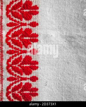 assamese gamosa ( gamusa , gamocha ) textile background ,gamusa pattern or gamosa border. gamosa is a traditional cloth of assam,north east. Stock Photo