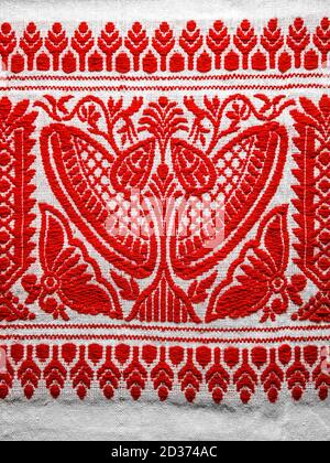 assamese gamosa ( gamusa , gamocha ) textile background ,gamusa pattern or gamosa border. gamosa is a traditional cloth of assam,north east. Stock Photo