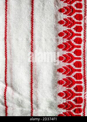 Image of assamese gamosa ( gamusa , gamocha ) textile background. red and  white peace of cloth and treditional cloth of assam.-DC123732-Picxy