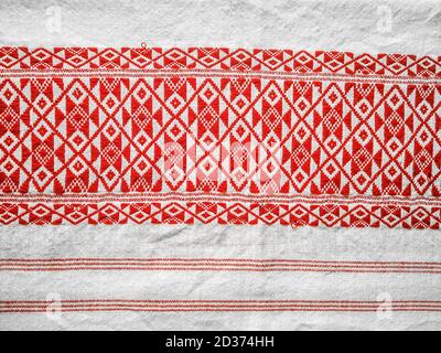 assamese gamosa ( gamusa , gamocha ) textile background ,gamusa pattern or gamosa border. gamosa is a traditional cloth of assam,north east. Stock Photo