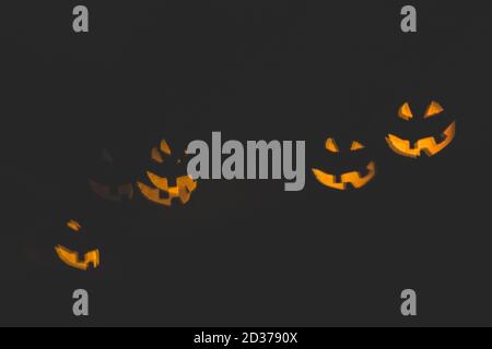 Noise and blurred abstract background with pumpkin faces bokeh light Stock Photo