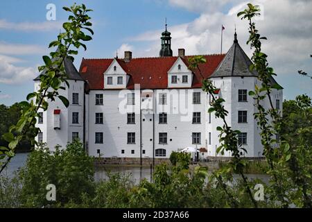 The historic white castle of Glucksburg in Flensburg Germany. The forefathers of the Danish Royal Family lived here. Stock Photo