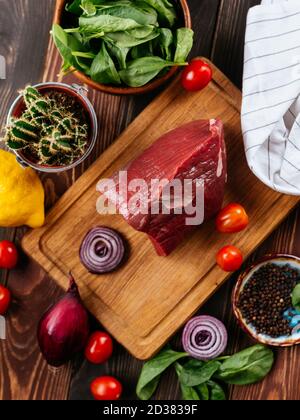 Fresh beef tenderloin on a wooden Board Stock Photo