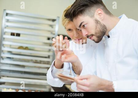 portrait of workers making chocolate Stock Photo