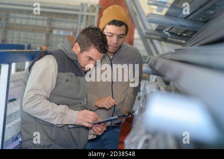 men working in newspaper factory Stock Photo
