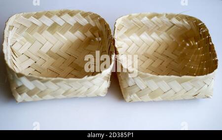 Besek (containers made of plaited bamboo) on white background. Stock Photo