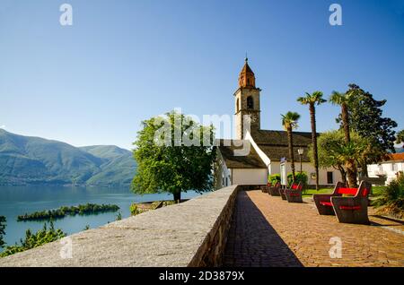 Church and Brissago Islands on an Alpine Lake Maggiore with Mountain in Ronco sopra Ascona, Switzerland. Stock Photo