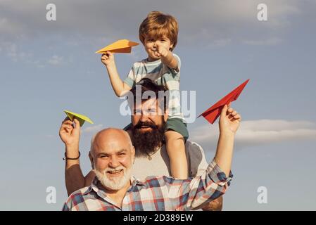 Men generation. Father and son with grandfather - happy loving family. Generation of people and stages of growing up. Father and son enjoying outdoor Stock Photo