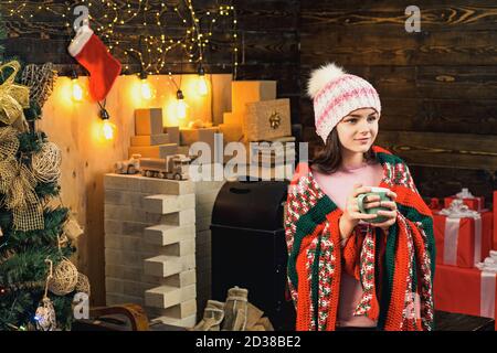 Children gift on Christmas Holidays. Winter evening at home. Happy Winter child. Teenager hold Christmas gift box. Stock Photo