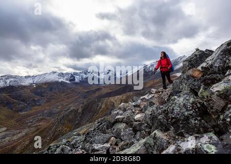 Girl Backpacking along Scenic Hiking Trail Stock Photo