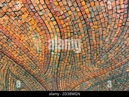 Multicolored motley colourful tiny old soviet tiles bricks on the building wall background. Stock Photo