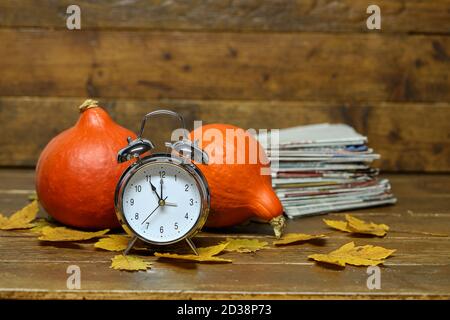 Autumn still life with an old alarm clock. Stock Photo