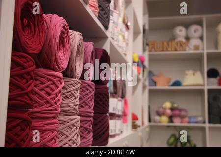 t-shirt yarn balls light gray color on brown background. Handmade craft recycle eco concept Stock Photo