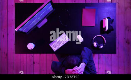 A programmer working on his computer having pain in his neck. Stock Photo