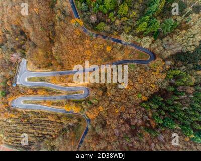 Seasons Concept winter or fall Aerial view of Winding road serpentine from a high mountain pass in the mosel village Brodenbach Germany Stock Photo