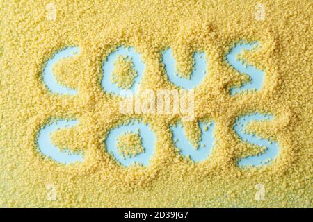 Words cous cous made of couscous on blue background Stock Photo