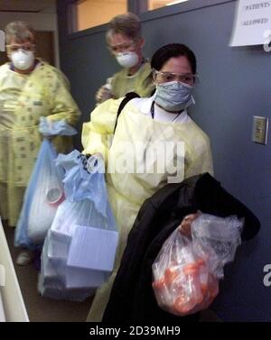 Nurses In Full Protective Clothing Move Bags Of Medical Supplies Prior To Opening The Fourth Severe Acute Respiratory Syndrome Sars Assessment Clinic In Ontario At The Trillium Hospital In The West End