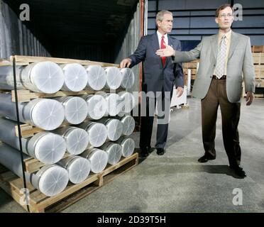 U.S. President George W. Bush tours a display of materials and equipment collected in Libya with the Manager of National Security Advanced Technologies, Jon Kreykes (R), in the Fusion Building of the Oak Ridge National Laboratory in Tennessee, July 12, 2004.