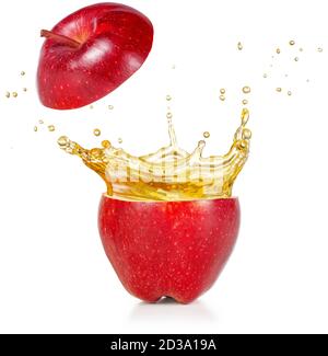 transparent juice squirting out of a red apple isolated on white Stock Photo