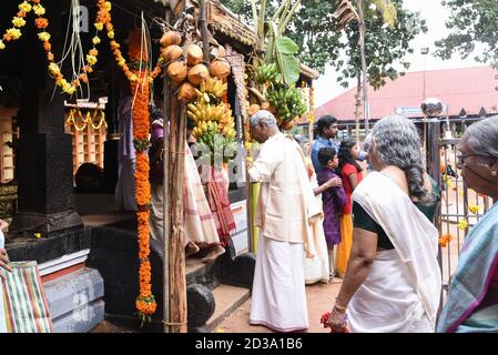 Kerala Indian people praying in a Hindu temple during Diwali festival. Popular Hindu temple festivals Onam Kerala India Thrissur Pooram Stock Photo