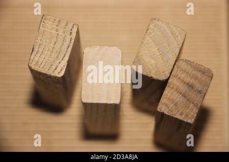 four wooden cubes, standing on packing paper background Stock Photo