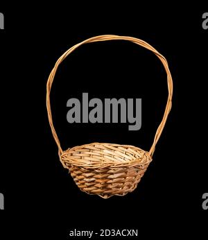 Wooden flower basket with isolated on a black background. Stock Photo