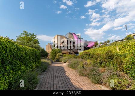 Elciego, Spain - 6 August 2020: Winery of Marques de Riscal in Alava, Basque Country. The futuristic building and luxury hotel was designed by famous Stock Photo