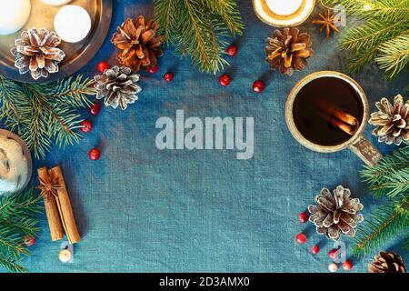 Cup of hot drink on christmas background. Cozy evening, mug of mulled wine, xmas Stock Photo