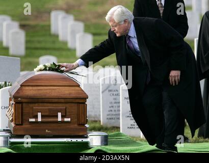 U.S. Senator Ted Kennedy (D-MA) lays flowers on the casket of U.S. Marine Lance Cpl. Dimitrios Gavriel during his military funeral at Arlington National Cemetery near Washington DC, December 2, 2004. Gavriel, from Haverhill, Massachusetts died November 19 while fighting in Al Anbar Province in Iraq and his funeral is the 99th 'Operation Iraqi Freedom' funeral at Arlington National Cemetery. REUTERS/Jason Reed  JIR