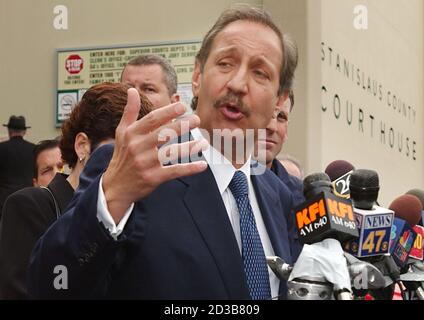 Los Angeles lawyer Mark Geragos answers questions from journalists after a hearing in the Stanislaus County Courthouse in Modesto, California, May 2, 2003. High-profile criminal defense lawyer Geragos was appointed on Friday to represent Scott Peterson, who told a court last week he could not afford an attorney to defend himself against charges of murdering his wife Laci and their unborn child. REUTERS/Tim Wimborne  TBW/GN