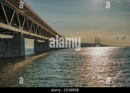The Oresund Bridge is a modern, imposing engineering construction that connects Denmark to Sweden across the Oresund strait in the Baltic Sea Stock Photo