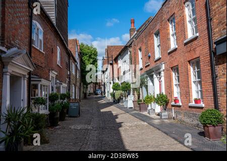 Old stone and brick houses in the narrow, cobbled Lombard Street in Petworth, West Sussex, UK. Stock Photo