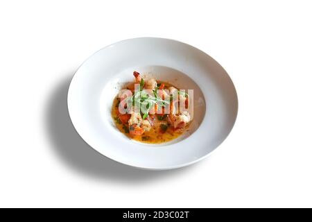 White round plate whith garlic shrimps. Isolated on white with clipping path Stock Photo