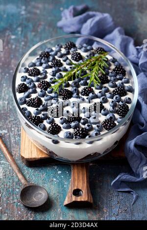 Blueberry and blackberry dessert, tiramisu, cheesecake, trifle or mouse, selective focus Stock Photo