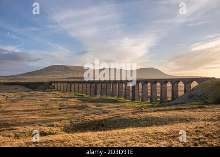 Ribblehead Viaduct from Batty Moss, with view of Ingleborough Hill in the distance. Ribblesdale, North Yorkshire, Yorkshire Dales National Park. Winte