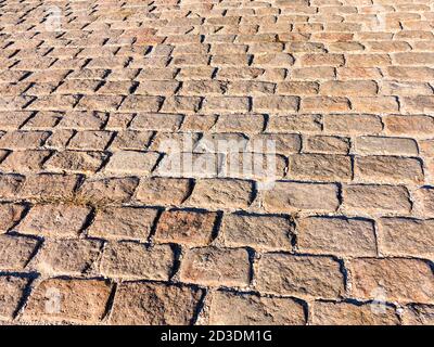 Urban stone paving stones. Texture, background, selective focus Stock Photo