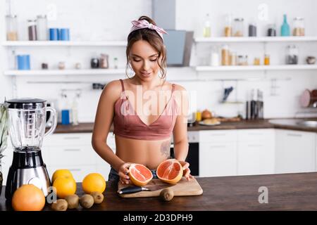 Young Woman Small Boobs Puts Big Fruit Grapefruit Her Bra Stock Photo by  ©Voyagerix 377214972