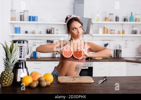 Young Woman Small Boobs Puts Big Fruit Grapefruit Her Bra Stock Photo by  ©Voyagerix 377214972