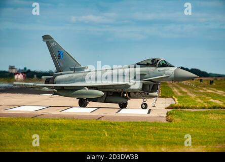 Lossiemouth Eurofighters FGR4s returning to UK after Op' Azotize in Lithuania, supporting NATO Baltic Air Policing. All four carry the NATO 70th badge Stock Photo